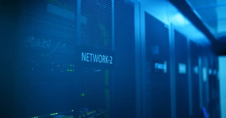 IT security team reviewing network access policies on screens in an office
